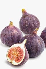 Ripe juicy figs on a white background.