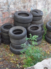 A pile of old tyres in junkyard