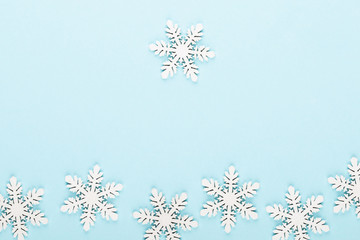 Sea salt, chamomile aromatherapy oil in bottles on vintage blue background.