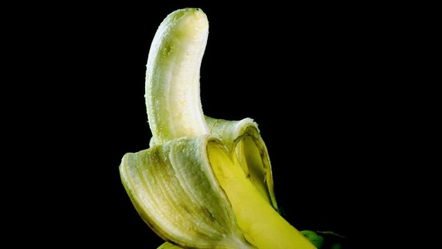 Rotating peeled banana fruit