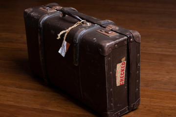 Old suitcases on a wooden floor