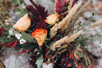 Wedding floristry in a yellow autumn meadow. 
