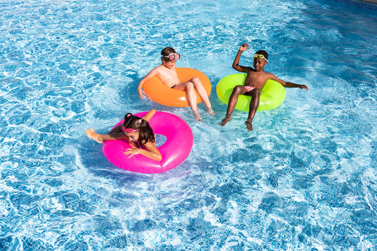 kids smiling and happy at the pool