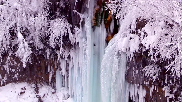 High angle winter view of Whitebeard Falls and Biei River, Japan