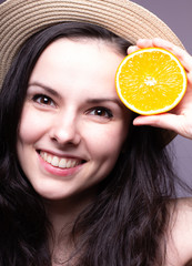 beautiful young girl with oranges