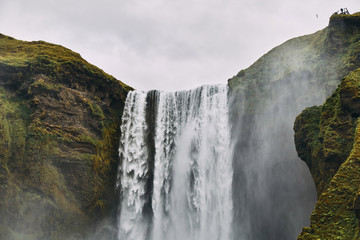 Beautiful scenery of the majestic Skogafoss Waterfall in countryside of Iceland in summer. 