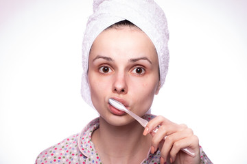 beautiful young woman cleaning teeth