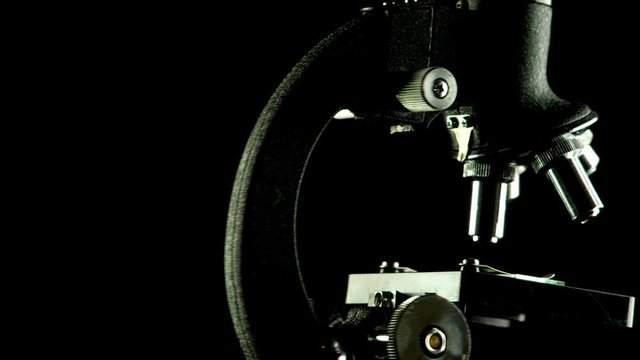 Rotating microscope scientific research seamless looping background