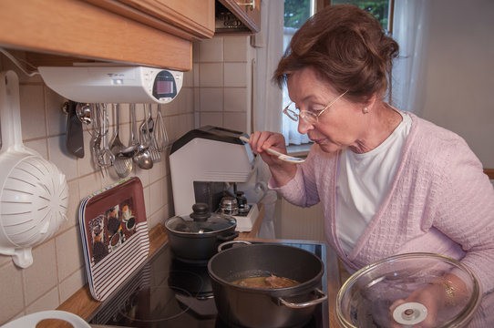 Senior woman cooking in the kitchen