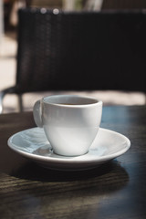 Cup of italian coffee  on the dark table