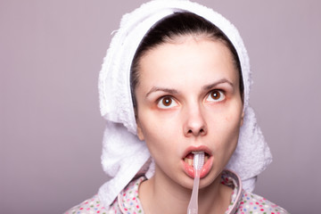 beautiful girl brushing her teeth