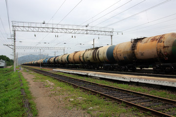 Fototapeta na wymiar Oil trading. Freight transportation of liquids by rail in tanks.