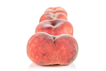 Group of four whole fresh red peach prunus persica platycarpa in row isolated on white background