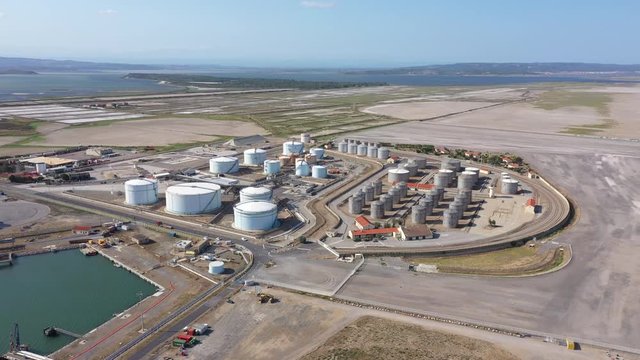 aerial large view  of stockage tankers silos gas petrol storing bulk materials Port-la-Nouvelle industrial harbor France Aude Occitanie