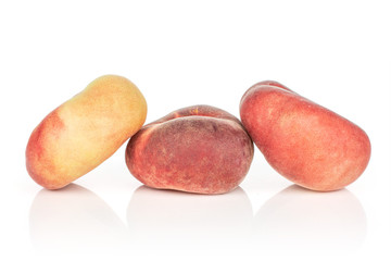 Group of three whole fresh red peach prunus persica platycarpa isolated on white background