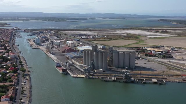 Commercial harbor Port la Nouvelle grain silos stockage aerial shot sunny day 