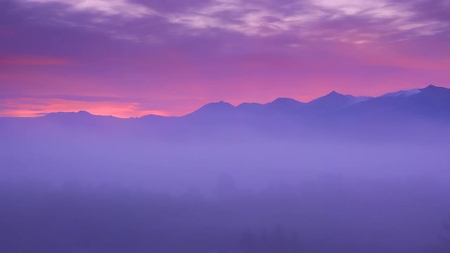 Tokachi mountains above fog at sunrise, Kamifurano, Hokkaido, Japan