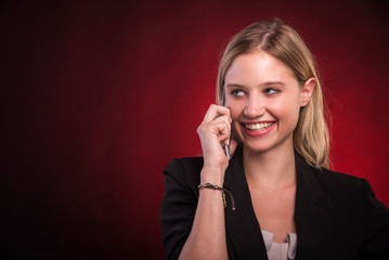Young business lady smiling and talking on her phone