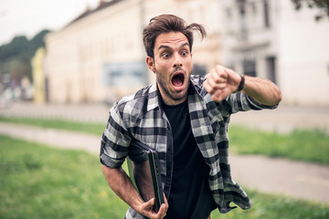 Young and attractive urban guy being late for his appointment - obrazy, fototapety, plakaty