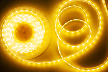 bright yellow LED strip, diode strip, a coil  of silicone strip