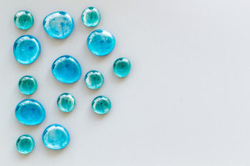 Glass stones for design and home creativity on gray background top view space for text