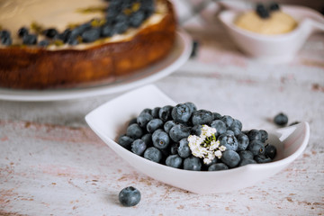 Fresh blueberry, cheesecake dessert on white table