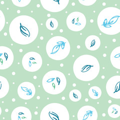 Summer spring leaves and bubbles seamless pattern in white, greens and blues with cool, fresh and clean look. Hand drawn leaves for fashion, textile, wrapping paper and wallpapers.