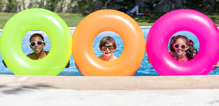 kids smiling and happy at the pool