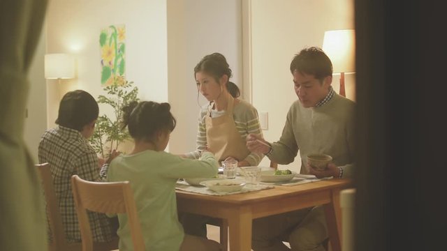 Family talking at dinner table