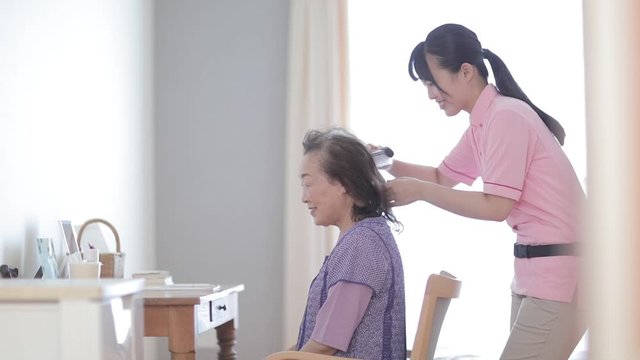 healthcare professional and senior woman, Japan