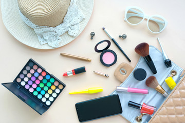 Handbag makeup accessories women and fashion stylish clothes cosmetic. girl colorful outfit and decorative fashion professional equipment attractive fashion lady on purple background .Beauty concept