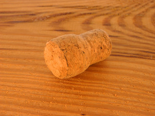 cork isolated on wooden background