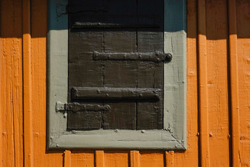 Stockholm, Sweden A detail of a shuttered window on an old Swedish cabin on Beckholmen.
