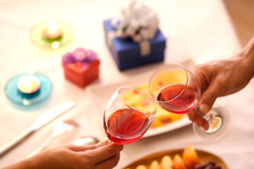 Hand of group friends celebrate successfully with red wine in the party. Young toasting in party and drinking after work hard for relax and be enjoy. Celebration Concept , Cheers!
