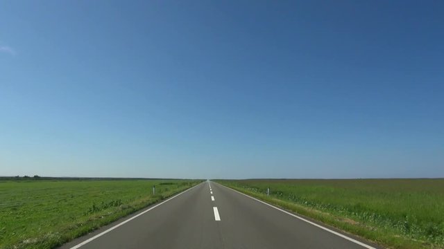 POV shot of empty road under clear sky, Sarumo, Hokkaido