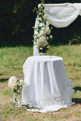 wedding ceremony decoration, chairs, arches, flowers and various decor