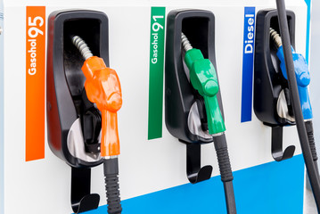Colorful Petrol pump filling nozzles isolated on white background , Gas station in a service in...