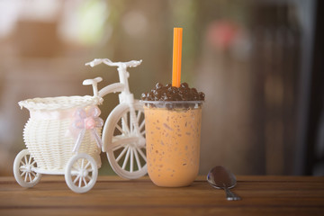 Ice bubble milk tea in takeaway glass.