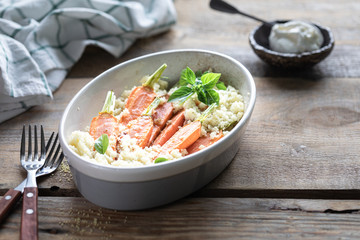 Young carrots baked with Pravanese herbs. couscous Sour cream, yogurt or fresh cream.