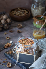 Obraz na płótnie Canvas Homemade granola with nuts and seeds in glass jar for healthy breakfast