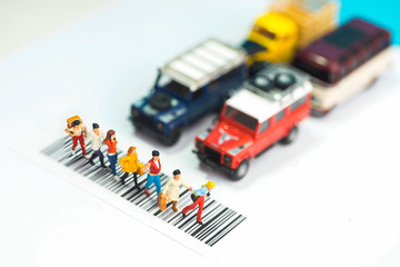 Miniature toys a group of women crossing a road - road safety concept.