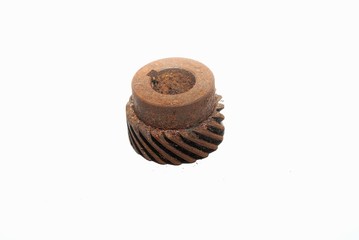 A rusty metal oxidation on a shaft drive gear.