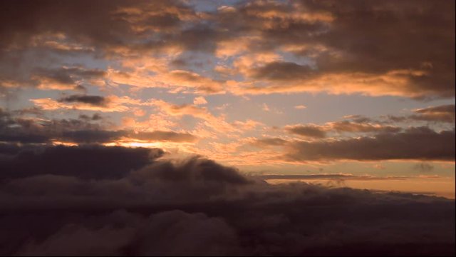 Timelapse of clouds flowing at sunrise
