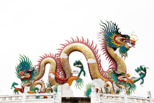 Chinese golden dragon statue isolated on white background.