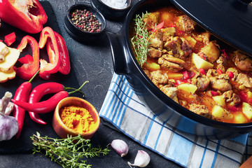 spicy chicken boneless thighs curry in a pan