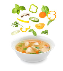 Dish with fresh homemade chicken soup on white background
