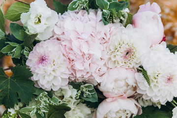 Wedding asymmetric bouquet of eustoma, peonies, dahlias, hydrangeas.