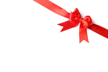 Red ribbon with bow isolated on white background. Gift concept