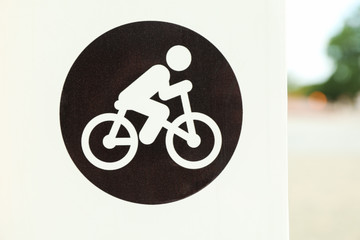 Sign for cyclists in park, close up
