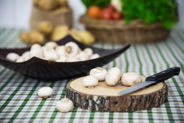 Fototapeta na wymiar Fresh champignon mushroom vegetable in the kitchen - fresh mushroom vegetable cooking concept